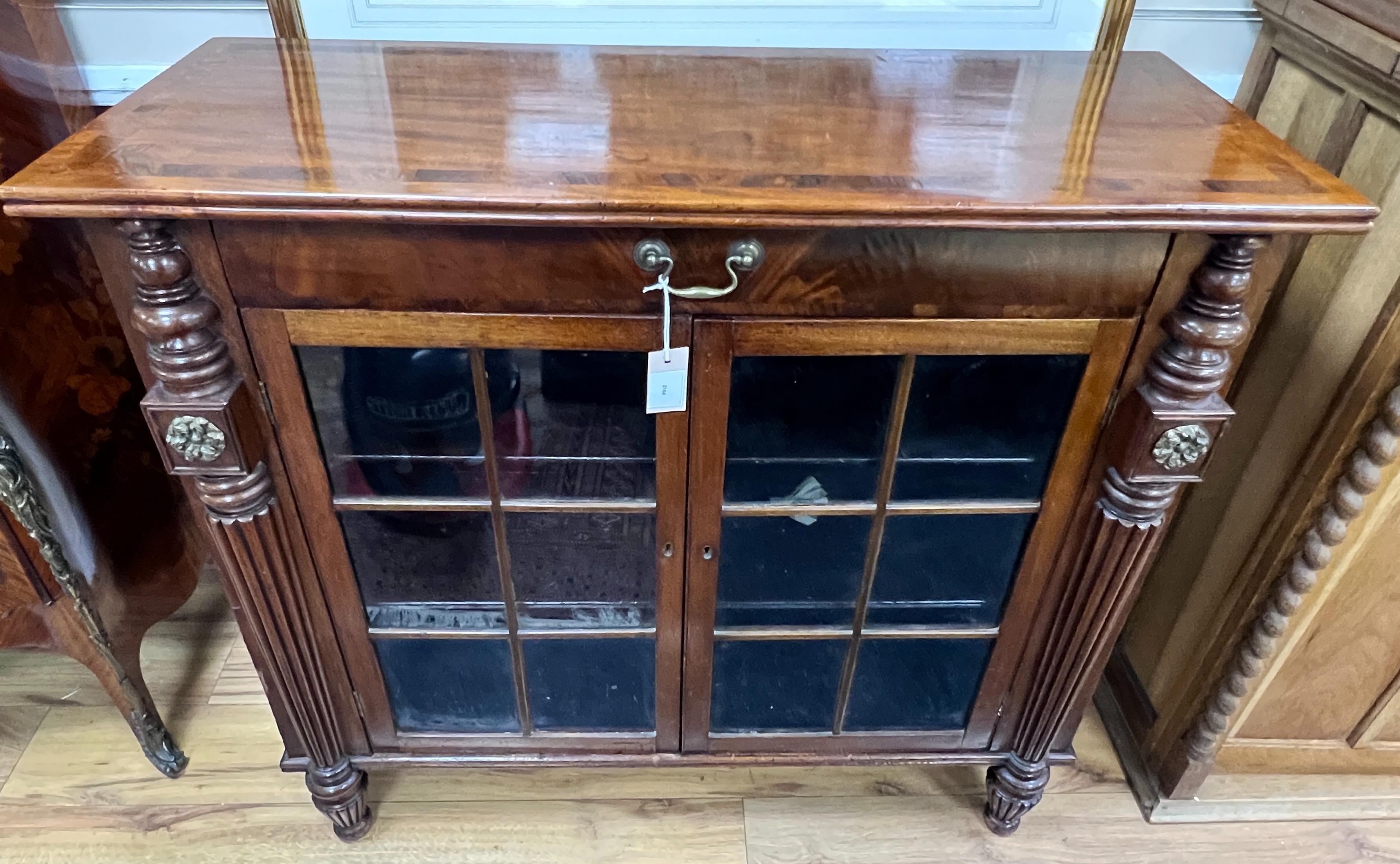 A George IV rosewood banded mahogany side cabinet, in the manner of Gillows, width 102cm, depth 40cm, height 93cm
